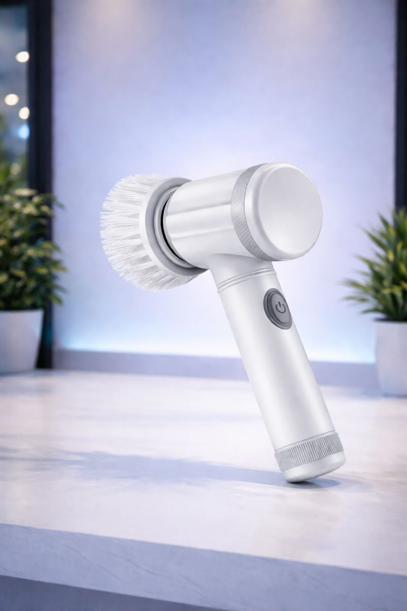 White handheld cleaning brush on a light surface with a blurred background